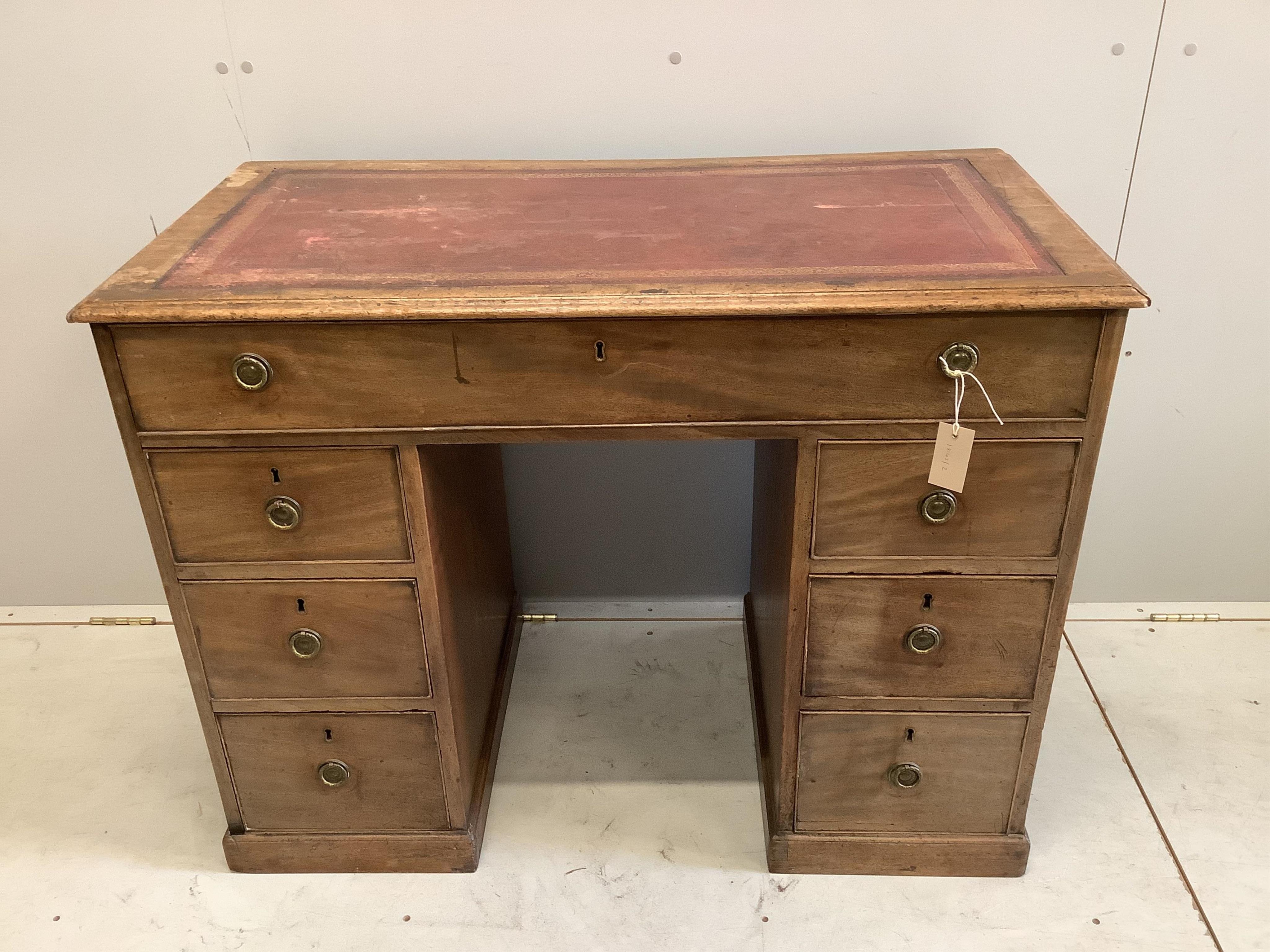 A mahogany seven drawer desk, width 102cm, depth 52cm, height 78cm